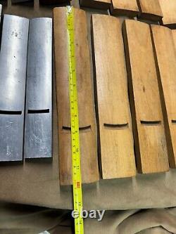 Odd set of 15 woodworking plane soles 10 wooden 5 cast aluminum most are radius