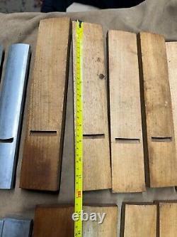 Odd set of 15 woodworking plane soles 10 wooden 5 cast aluminum most are radius